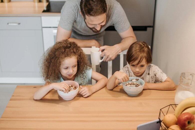 Photo by Pavel Danilyuk "MrBeast’s Guide to Living with Love and Prioritizing Health: Lessons for a Purpose-Driven Life" Father and children enjoying a hearty breakfast at home, creating a warm family moment.