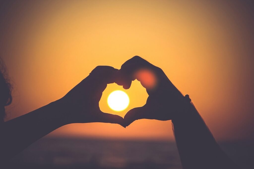Love in America: A Journey Through Connection and Diversity. 2 silhouette of person's hands forming heart Love in America: A Journey Through Connection and Diversity.
