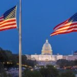 # Love and Health: The Social Impacts of Romance on American Government. Dramatic evening view of the U.S. Capitol with American flags in Washington, D.C.