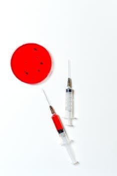 Lyme Disease, Love for Health, and America's Research Efforts. 2 Lyme Disease, Love for Health, and America's Research Efforts.Two syringes and a red petri dish on a white background in a laboratory setting.