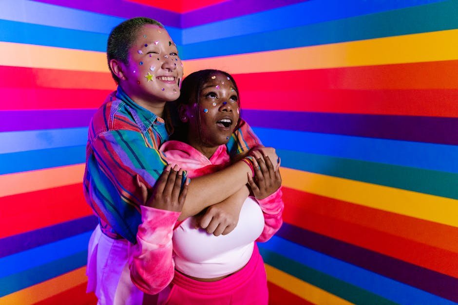 Health and Love: The Secrets Behind the Happiness of USA Stars. 2 Health and Love: The Secrets Behind the Happiness of USA Stars.Joyful couple embracing against a vibrant rainbow background celebrating diversity.