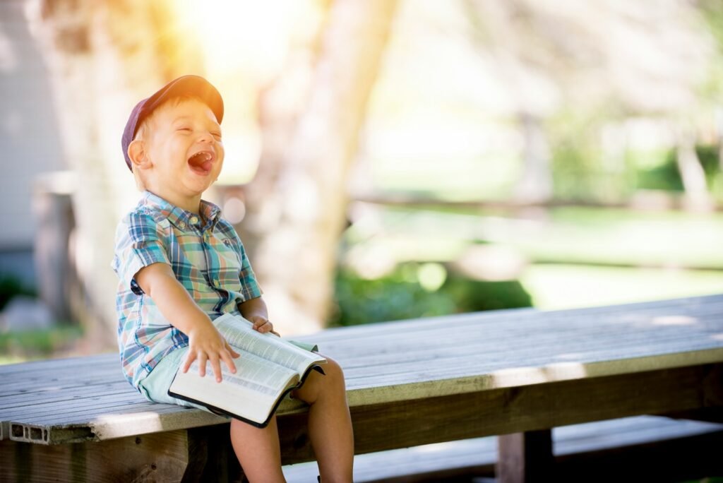 Embracing Health in the Face of Mortality: Understanding Life, Death, and Well-being. 2 Embracing Health in the Face of Mortality: Understanding Life, Death, and Well-being..boy sitting on bench while holding a book