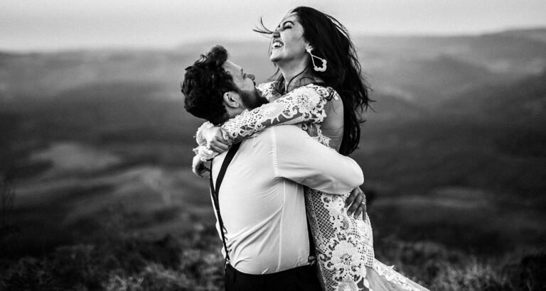 The Unyielding Power of Love.(grayscale photography of man and woman hugging near hill)