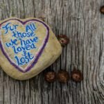 The memory of love continues in our soul. .a heart shaped rock with a message written on it