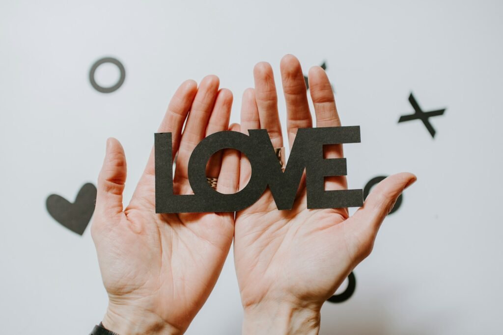 The Transformative Power of Love: A Journey Through Emotions and Impact. 2 The Transformative Power of Love and Health: A Journey Through Emotions and Impact.(person holding love word cutout paper)