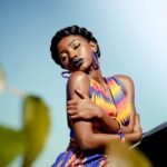 Self-Love and Physical Wellness in 2025: How Loving Your Body Leads to a Healthier, Happier Life(woman in yellow blue and red tank top)