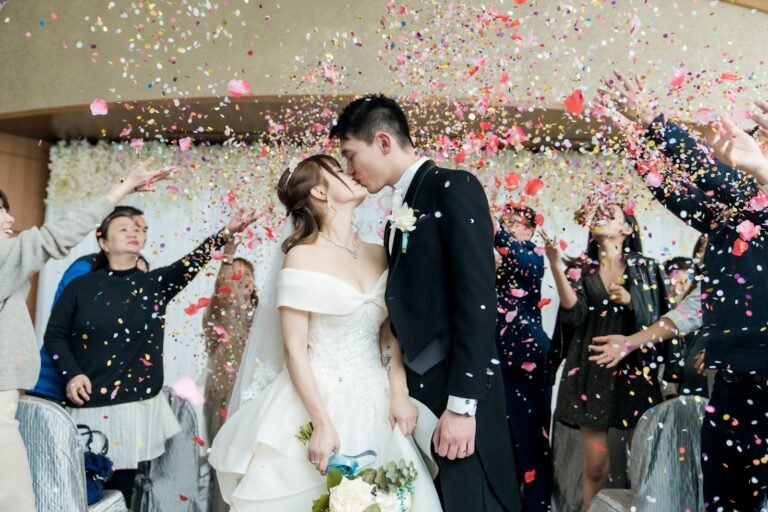 The Impact of Love, Marriage, and Overall Wellbeing on Reducing Stress | Love and Health Future.(man in black suit kissing woman in white wedding dress)