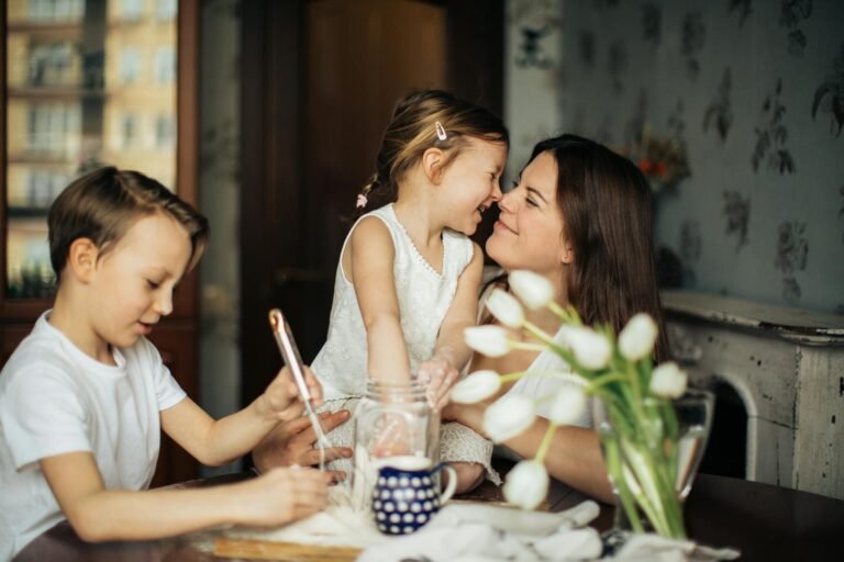 The Unwavering Anchor: A Symphony of Mothers' Love and Care.(A joyful moment of a mother baking with her children in a cozy home environment.)