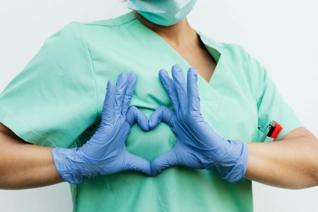 Transform Your Life with Love and Health: 25 Wellness Tips for a Vibrant Future 2 Transform Your Life with Love and Health: 25 Wellness Tips for a Vibrant Future.(Medical professional forming a heart shape with blue gloves. Symbol of care and compassion.)