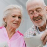 Love and Memory: Woven Threads of the Heart – A Deep Dive into Emotional Memories, Relationship Growth, and Healing Through Nostalgia(Happy senior couple enjoying old photographs and sharing memories together.)