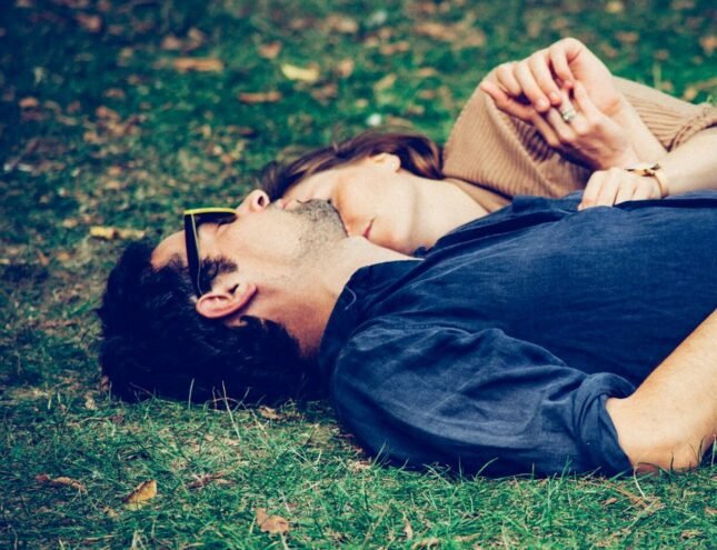 Love and Health: The Interconnected Path to a Fulfilling Future (man and woman lying on grass)