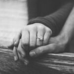 loveand health,10 Reasons Why Love Is Lovely And Healthy. a couple holding hands with a wedding ring visible