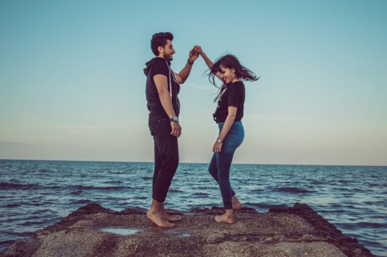 Balanced Love: The Hidden Key to Happiness in Modern Relationships, man and woman standing on rock