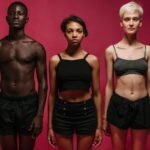 10 Health and Wellness Trends Define 2026: Smart Wellness & Emotional Health.(Part2) 7 10 Health and Wellness Trends Define 2026: Smart Wellness & Emotional Health.Three diverse individuals stand confidently against a pink background in fitness attire.