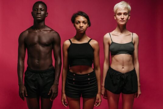 10 Health and Wellness Trends Define 2026: Smart Wellness & Emotional Health.(Part2) 1 10 Health and Wellness Trends Define 2026: Smart Wellness & Emotional Health.Three diverse individuals stand confidently against a pink background in fitness attire.