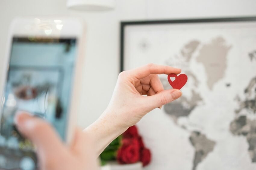 Photo by Pin Adventure Map A Sweet Celebration of Love in America: Valentine’s Week in 2025 — Traditions, Trends & Romantic Ideas., person holding red heart ornament